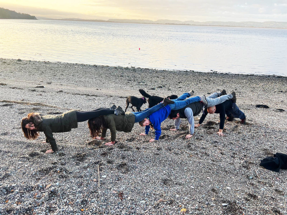 Team taking part in a mobile treasure hunt photo challenge during a UK team building event