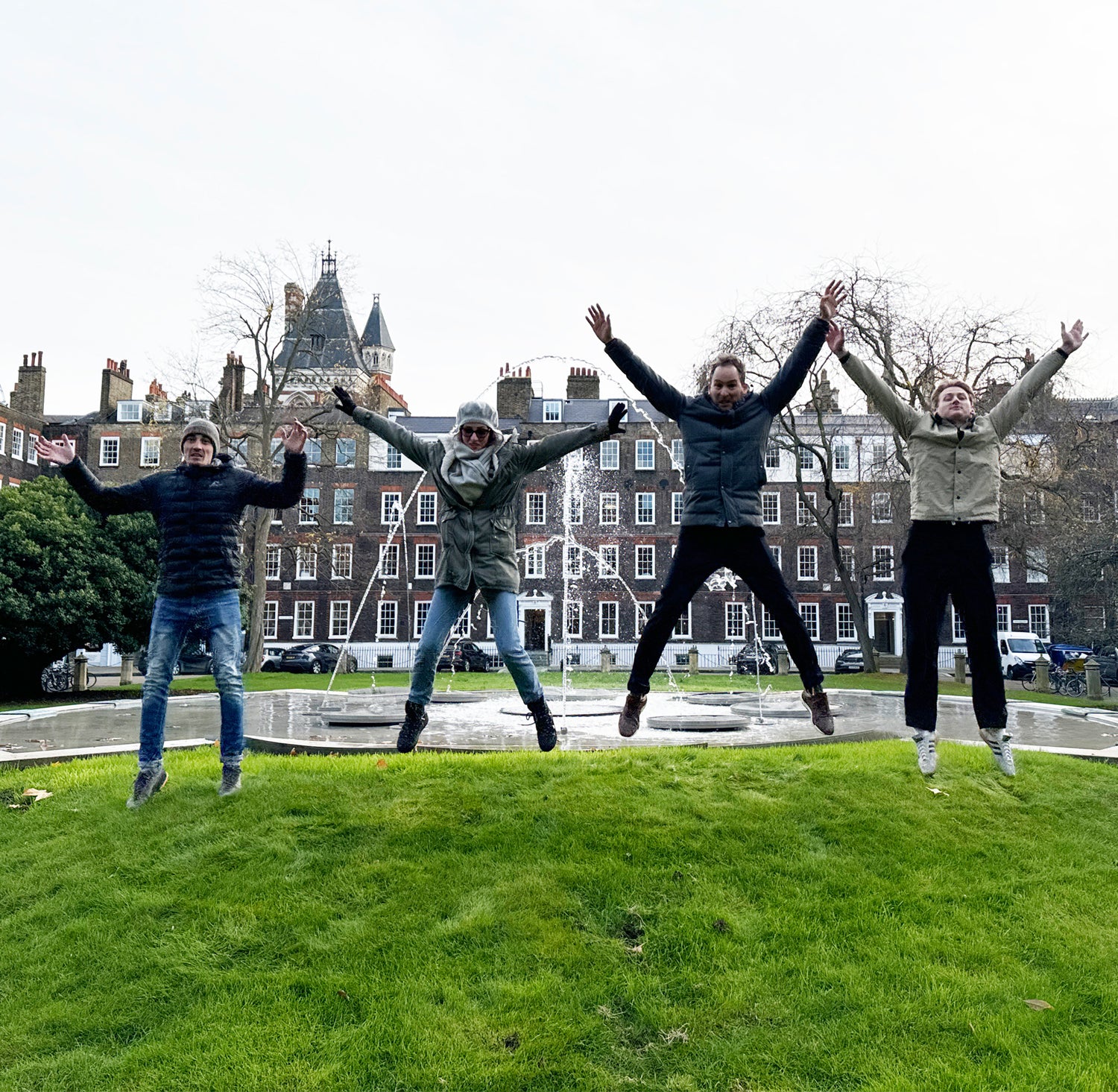 Colleagues collaborating on interactive photo challenges during a corporate team building treasure hunt