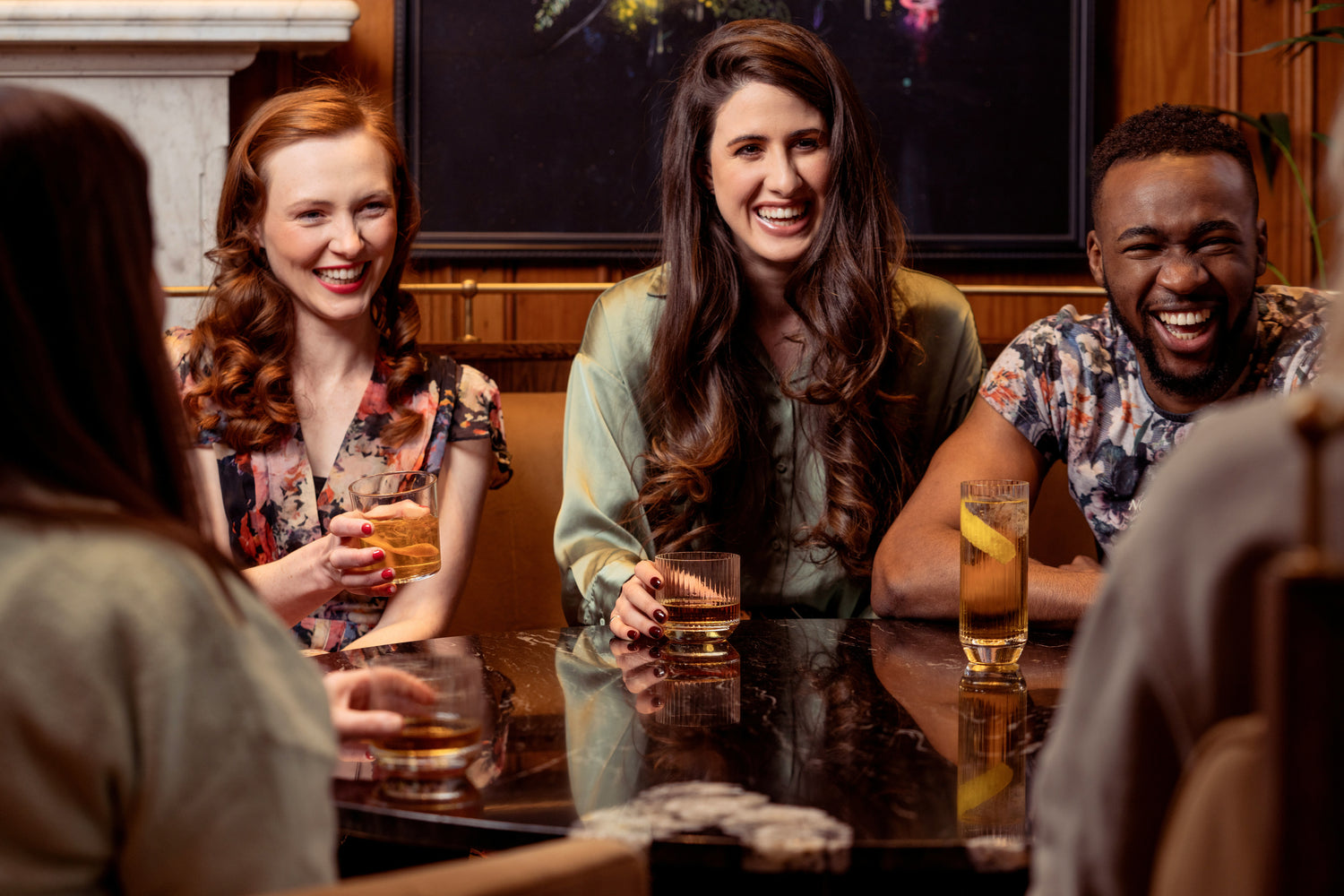 Friends celebrating in a Manchester pub after completing a treasure hunt