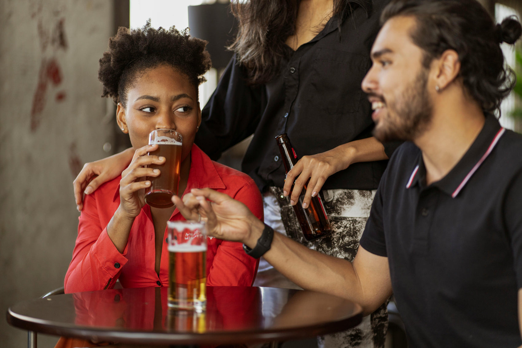 Friends celebrating in a Portsmouth pub after completing a treasure hunt