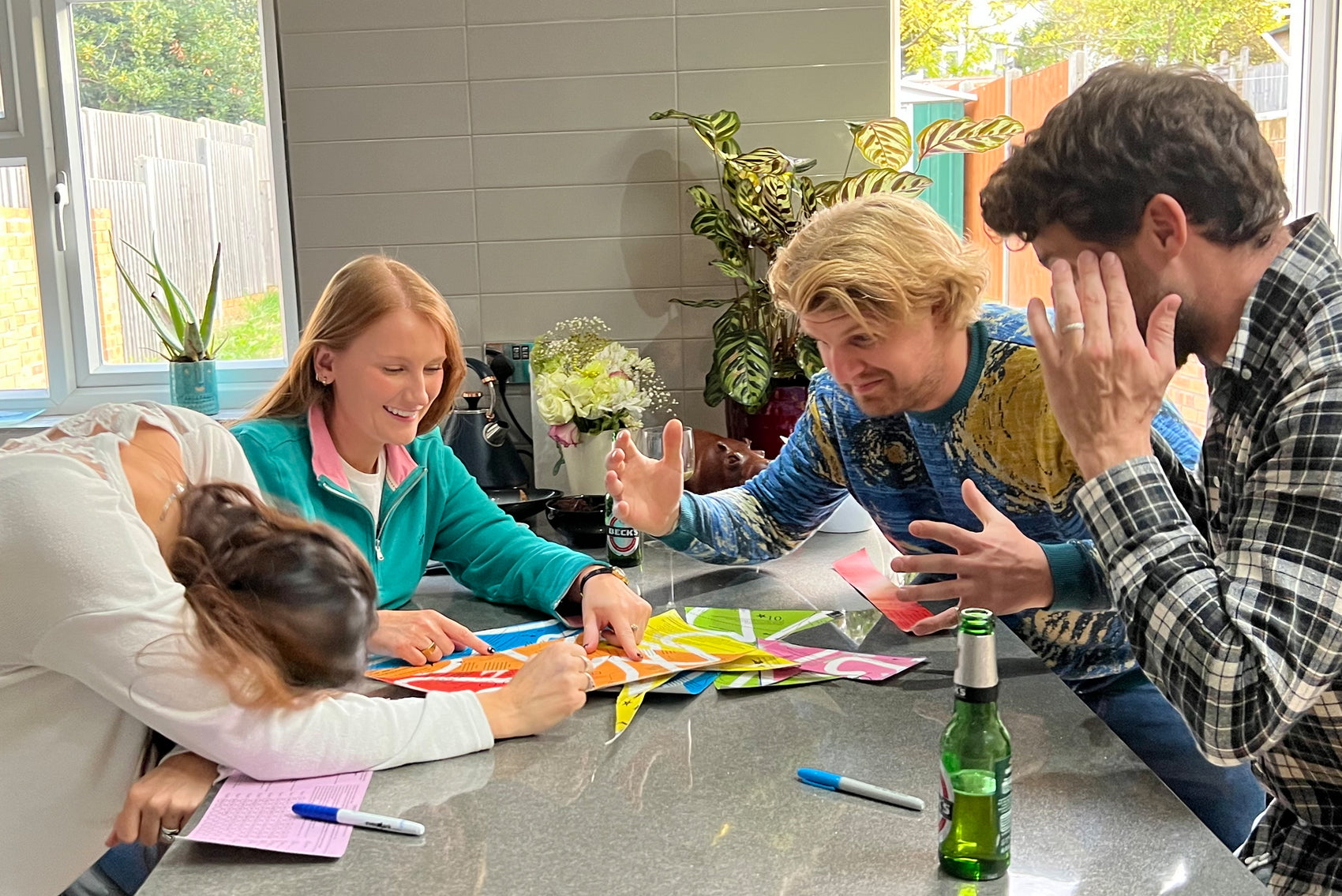 Group of people enjoying the Puzmat escape room puzzle mat game together