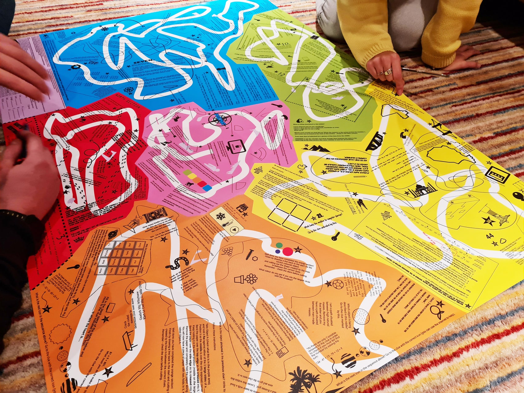 Group playing Puzmat game same concept different challenges