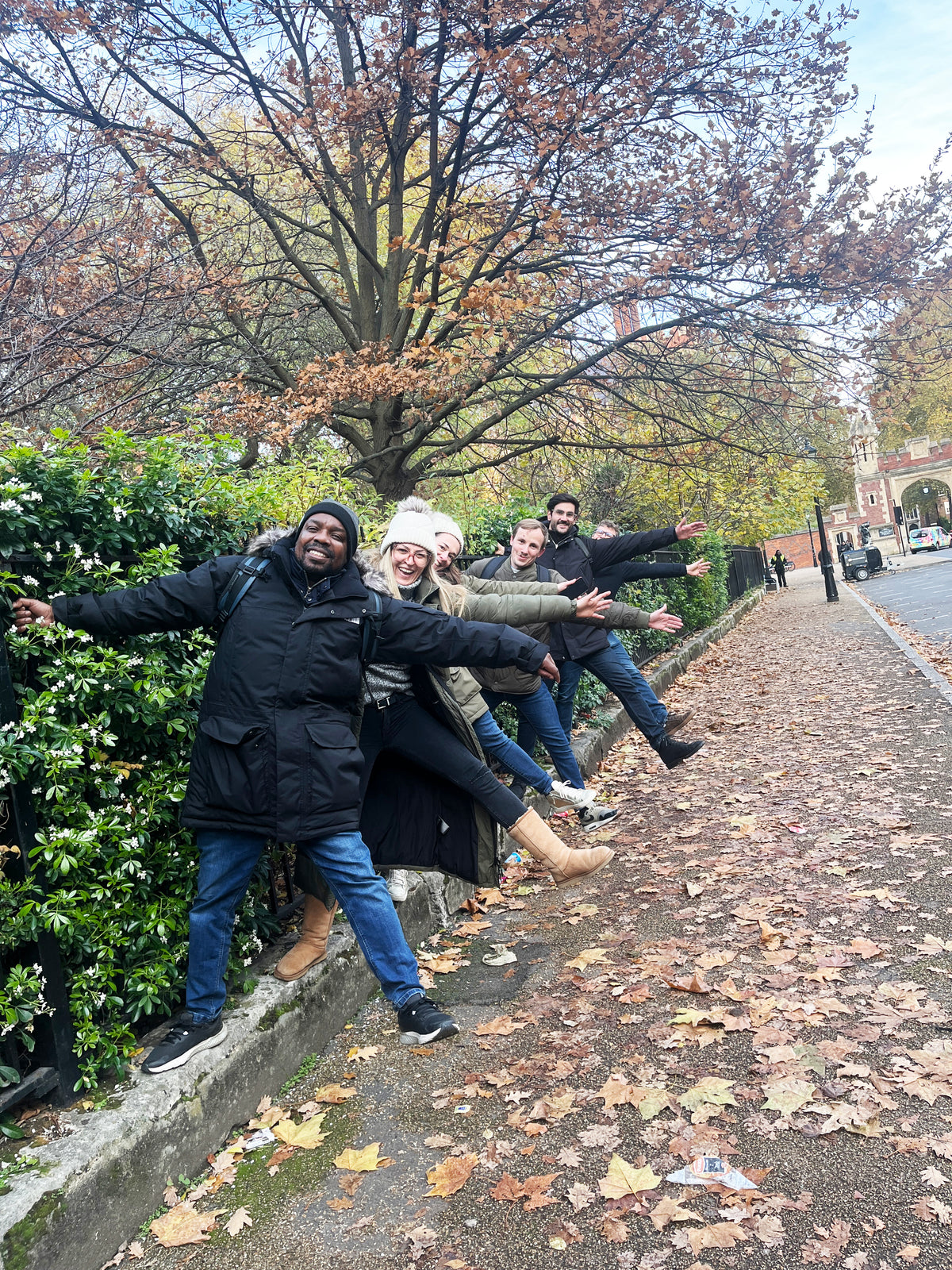 Team performing a star jump for points during a corporate treasure hunt team building day