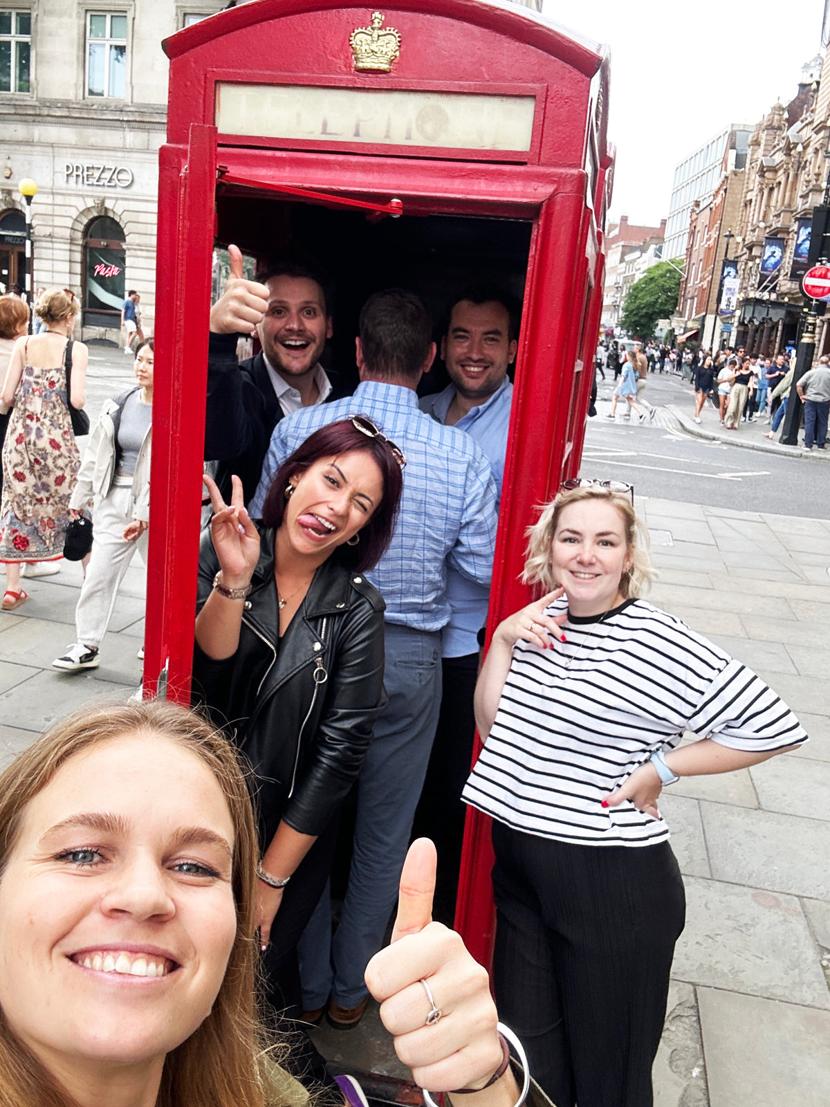 Corporate teams doing a treasure hunt with photo challenges during a team building day out