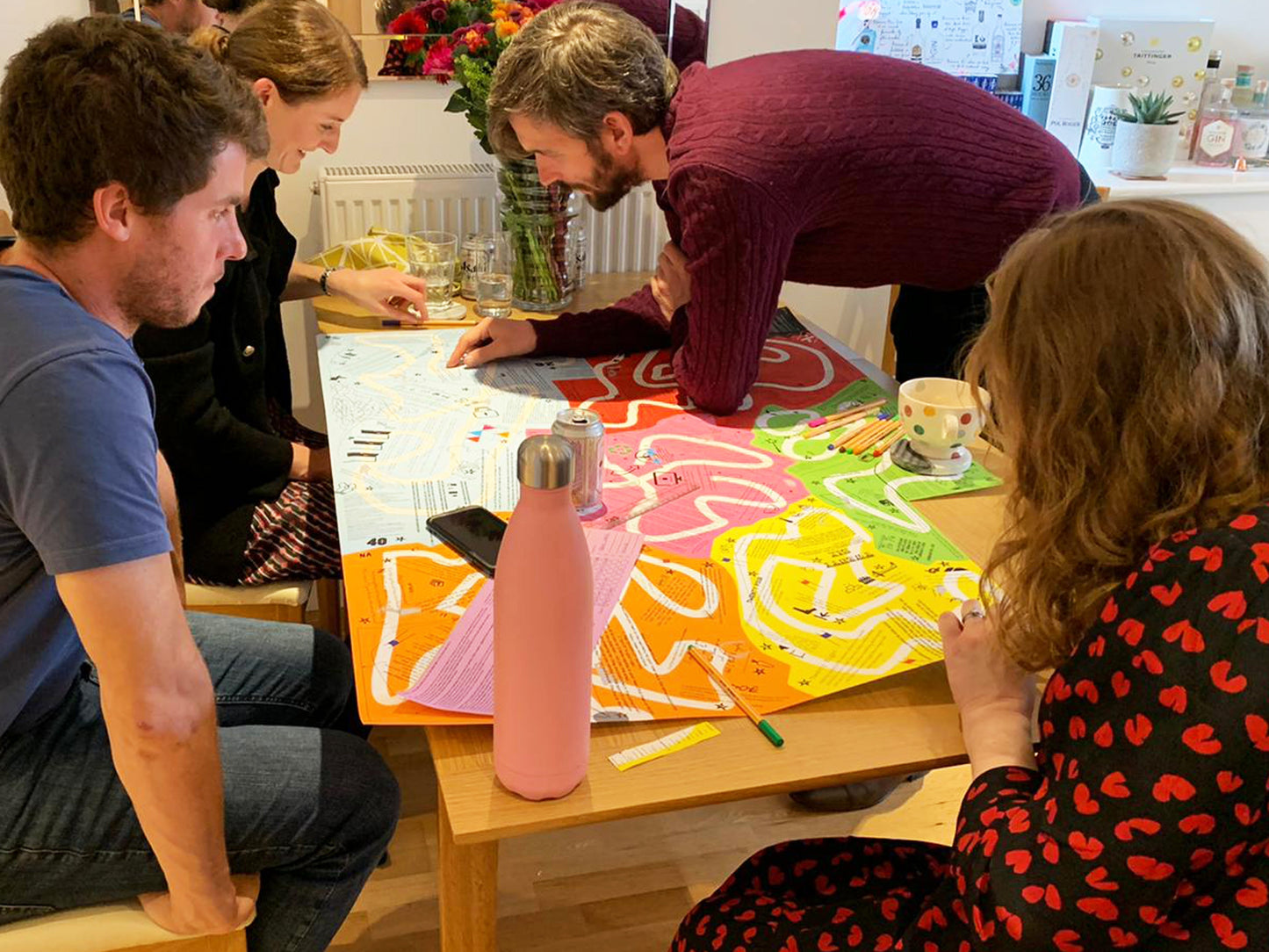 Family playing Puzmat in living room