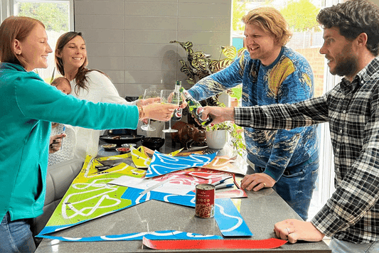 Group celebrating while playing Puzmat puzzle