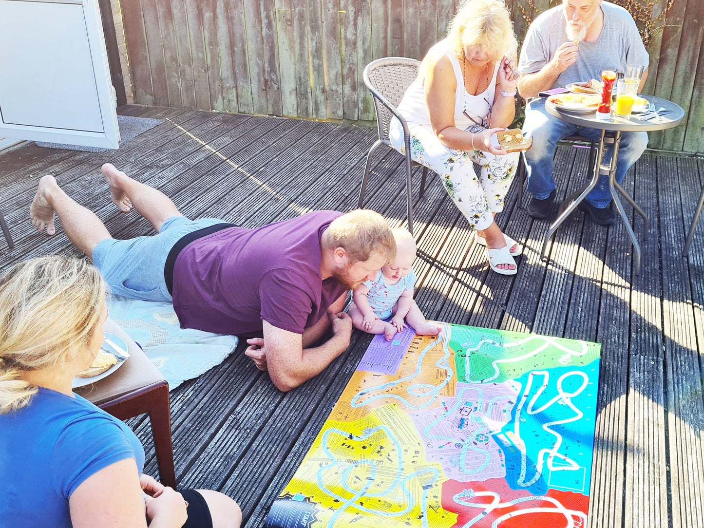 Group playing Puzmat on the floor