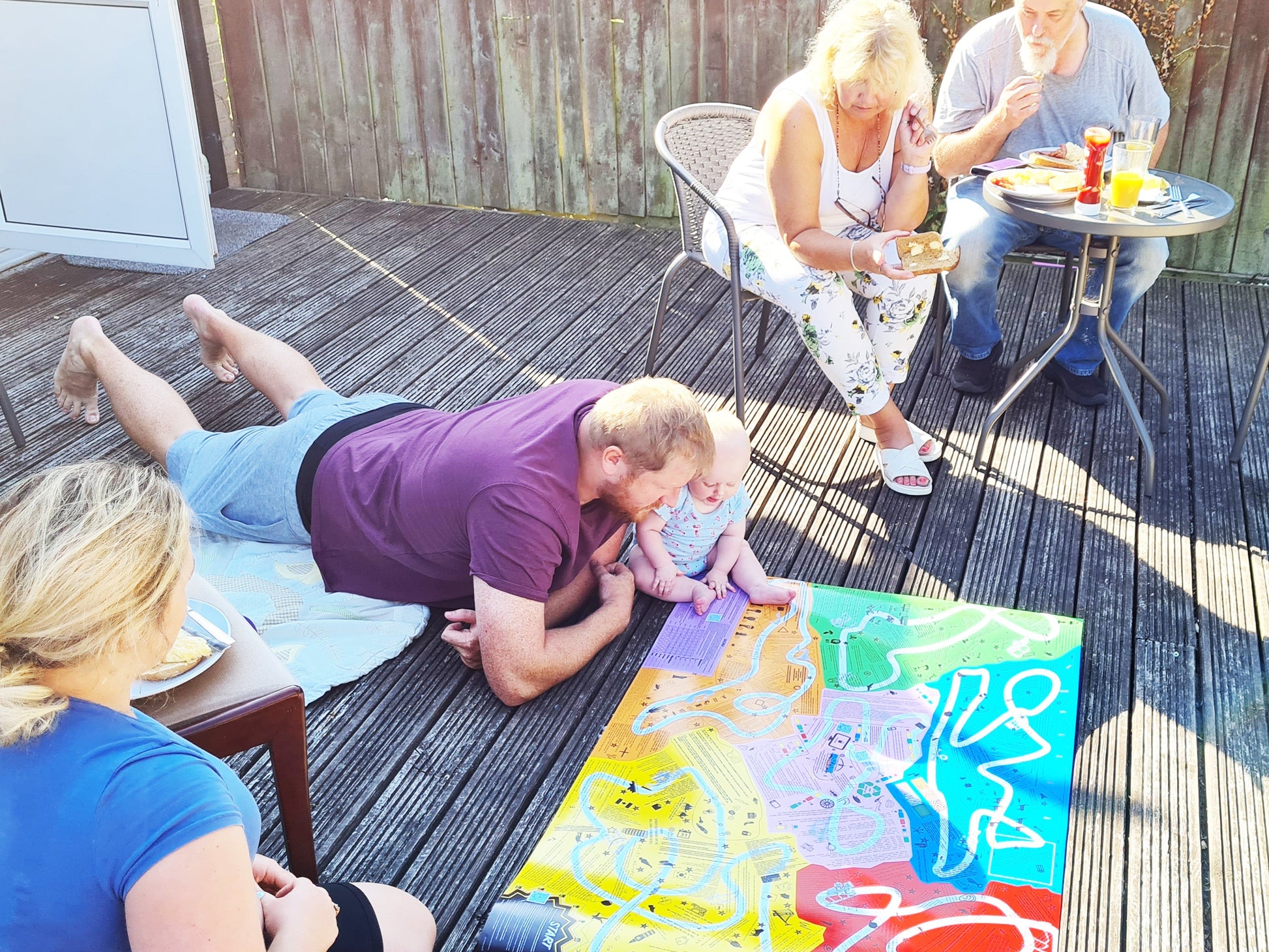 Group playing Puzmat on the floor